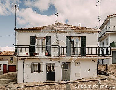 Two-story house with a balcony on the upper level in Madrid, Spain. Editorial Stock Photo