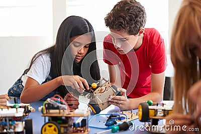 Two Students In After School Computer Coding Class Building And Learning To Program Robot Vehicle Stock Photo