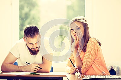 Two students talking in classroom Stock Photo