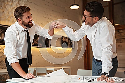Two successful confident smart businessmen working Stock Photo