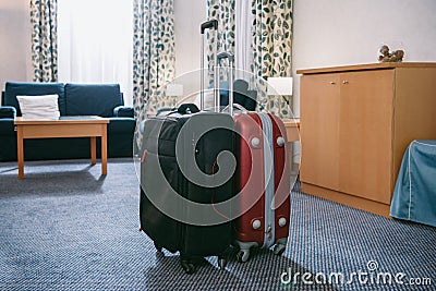 two suitcases standing in empty Stock Photo