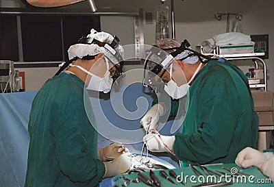 Two surgeons operating Stock Photo