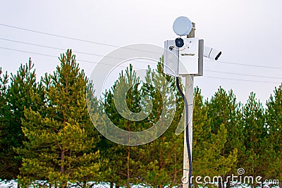 Two surveillance cams on top of a pole, seen from below against a blue sky Stock Photo