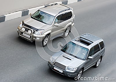 Two suv cars on road Stock Photo