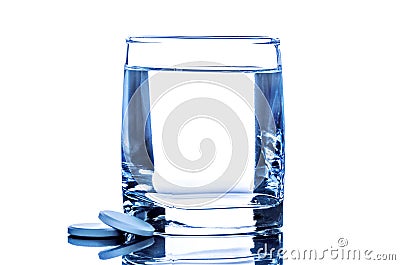 Two tablet near glass of water Stock Photo