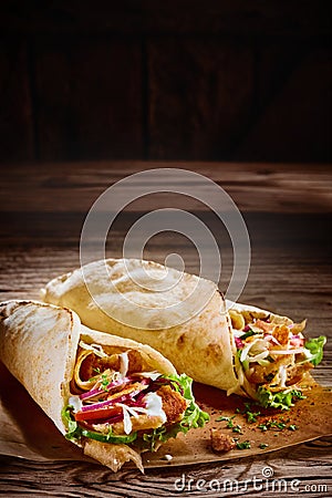 Two tasty doner kebabs with rustic copy space Stock Photo