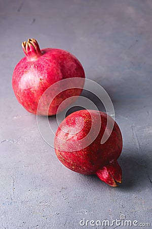 Two Tasty Fresh Ripe Pomegranate Pink Background Vertical Above Stock Photo