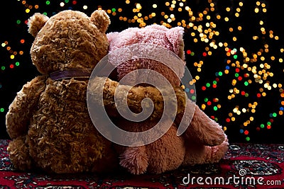 Two Teddie bear sitting holding bokeh background Stock Photo