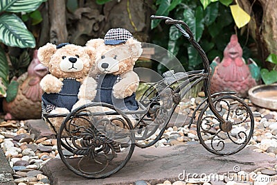 Two teddy bears on garden background Stock Photo