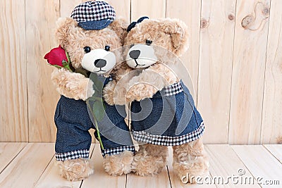 Two teddy bears on wood background Stock Photo