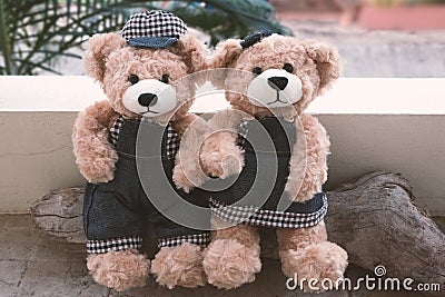 Two teddy bears on wood background Stock Photo