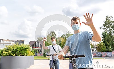 Two teenagers meet in a Park and greet each other without contact Stock Photo