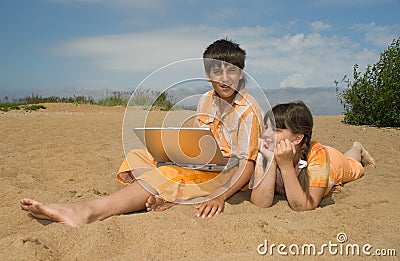 Two teens with laptops Stock Photo