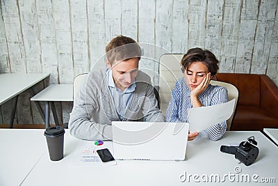 Two tired students cooperate work together office business teamwork. Stock Photo