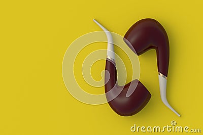 Two tobacco pipes on yellow background Stock Photo