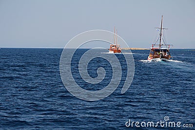 Two tourist wooden boats in the Aegean Sea Stock Photo