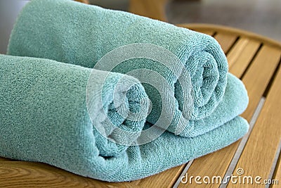 Two towels braided in a tubule on chair Stock Photo