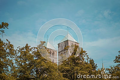 Two towers of Munster Cathedral behind the autumn trees. Germany. Stock Photo