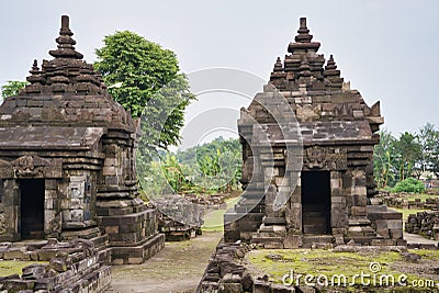 Two towers separated by a grass path in a Hindu stone temple Stock Photo