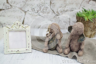 Two toy elephants handmade in vintage style.For postcards, posters for christmas day, holiday.Selective focus. Stock Photo