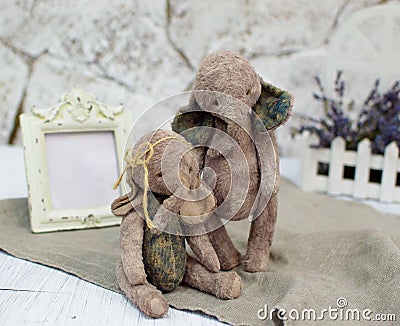 Two toy elephants handmade in vintage style.For postcards, posters for christmas day, holiday.Selective focus Stock Photo