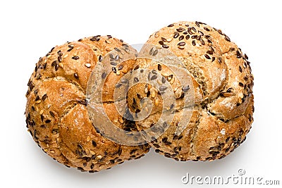 Two traditional whole wheat kaiser rolls with linseeds and sesame seeds isolated on white. Top view Stock Photo