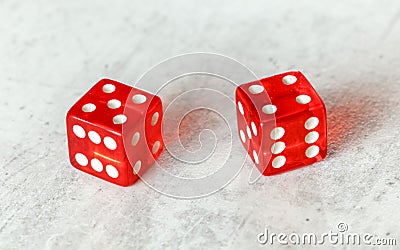 Two translucent red craps dices on white board showing Centerfield Nine Nina number 5 and 4 Stock Photo