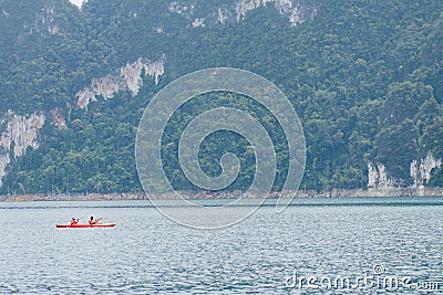 Travellers are sailing the orange boat in the sea in thailand Editorial Stock Photo