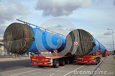 Oversize Load or exceptional convoy. A two truck with a special semi-trailers for transporting oversized loads Stock Photo