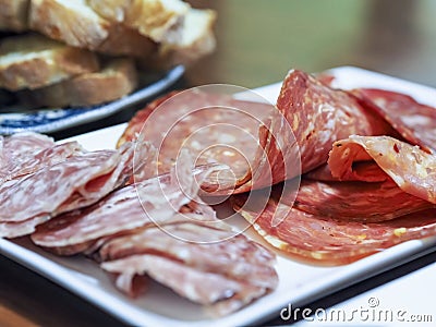 Two types of sliced salami on a serving plate as catering concept Stock Photo