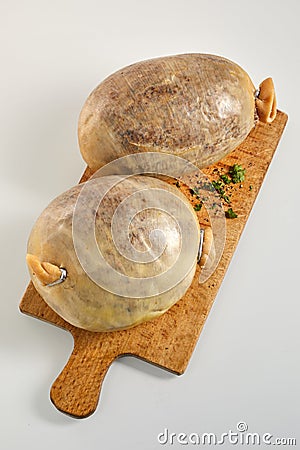 Two uncooked Scottish haggis on a wooden board Stock Photo