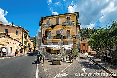 Two urban streets and small outdoor restaurant in Dolceacqua, Italy Stock Photo