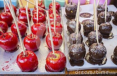 Two varieties of caramel apples. Chocolate and red Stock Photo