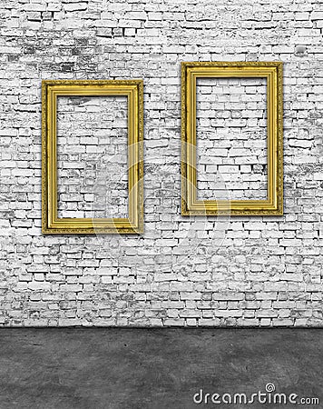 Two vertical golden frames on brick wall Stock Photo