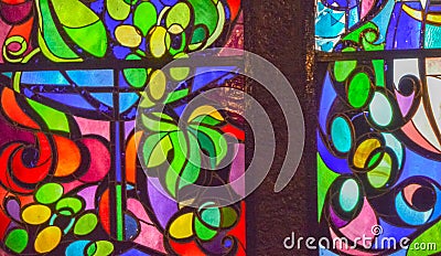 Two vertical stained glass windows with abstract background of multicolored glass with floral and fruit ornaments Stock Photo