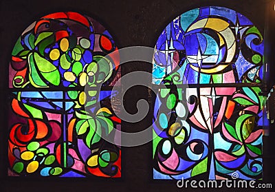 Two vertical stained glass windows with abstract background of multicolored glass with floral and fruit ornaments Stock Photo