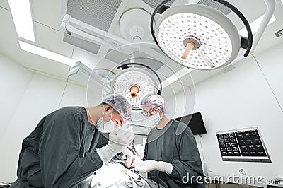 Two veterinarian surgeons in operating room Editorial Stock Photo