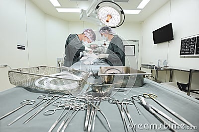 Two veterinarian surgeons in operating room Editorial Stock Photo