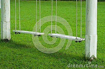 Two vintage hanging swing seats Stock Photo