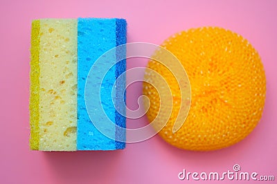 Two washcloths and a plastic brush for washing dishes. Stock Photo