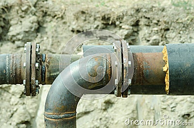 Two welded pipes with bolts and insulation close up. Stock Photo