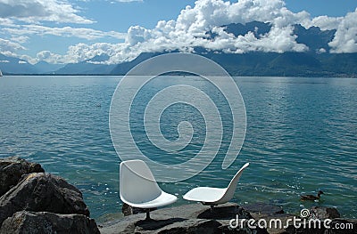 Two white chairs at Geneve lake Stock Photo