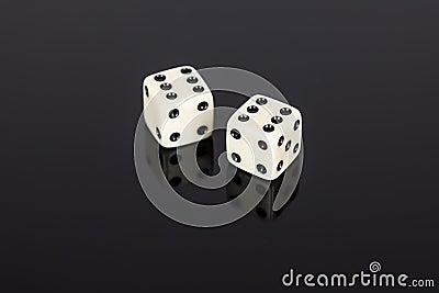 Two white gaming dice on black background Stock Photo
