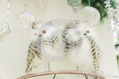 Two white snowy owls on a brach. Interior decoration Stock Photo