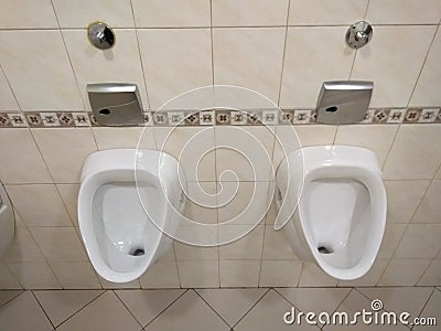 Two White urinal, pissoir on wall Stock Photo