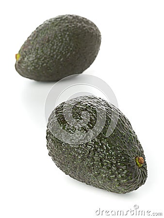 Two whole, uncut ripe avocado fruit Stock Photo