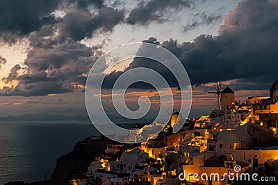 Two windmills of Oia after the sunset, Oia, Santorini, Greece Editorial Stock Photo