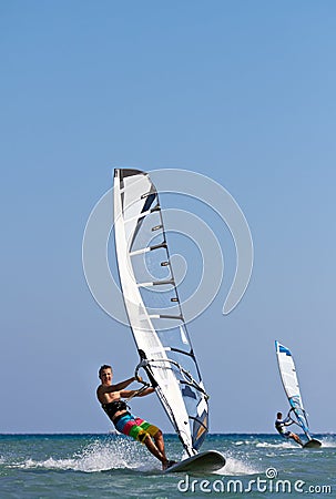 Two windsurfers in action Stock Photo
