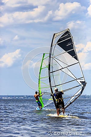 Two windsurfers in action Stock Photo