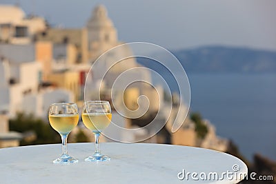 Two wine glasses at sunset Santorini Stock Photo